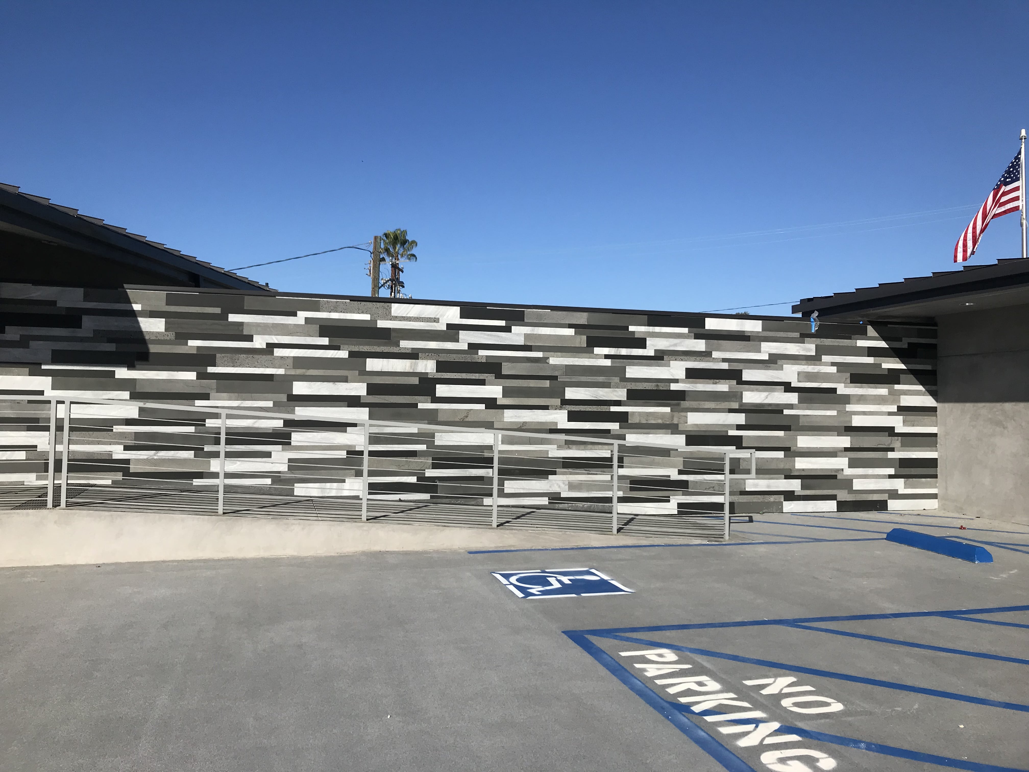 Commercial Exterior ADA Ramp with a large installation of Norstone Planc Large Format Tiles mixed in four colors